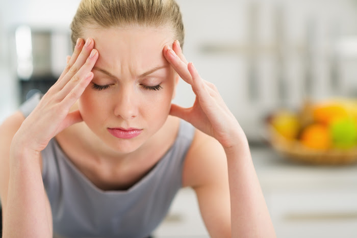 Synergy Research Centers - Woman Suffering from Migraine Headache Pain